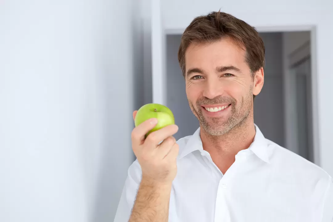 a man eats an apple to increase potency