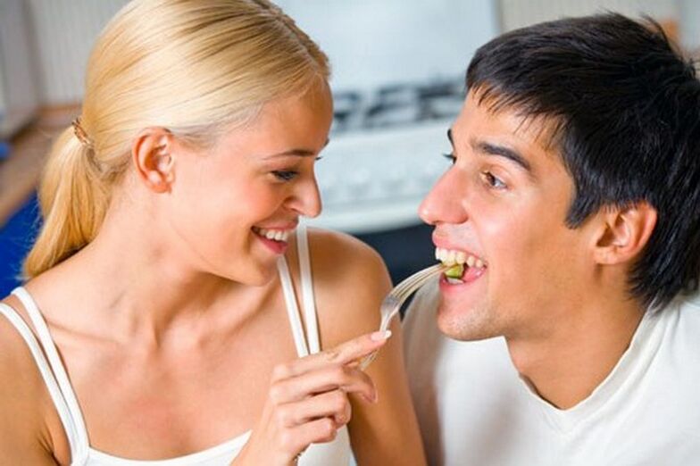 woman feeds man with products to stimulate potency